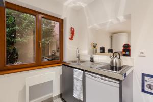 Appartements Travel Homes - L'Arsenal, studios en hyper centre : photos des chambres