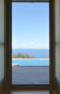 Family villa with a swimming pool and sea view in the area of Otzia Kea Greece
