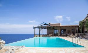 Waterfront villa with a swimming pool and fantastic sea view in the area of Melissaki Kea Greece