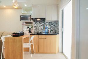 Modern Style 2BR Apartment Bassura City near Shopping Mall By Travelio