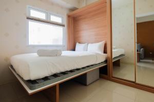 2BR Apartment Green Pramuka City near Shopping Mall By Travelio