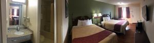 Deluxe Double Room (2 Adults + 1 Child) room in Motor Inns Of America