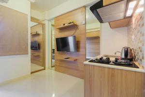 Modern Studio Apartment at 26th Floor Green Pramuka City By Travelio