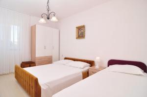 Three-Bedroom Apartment room in Apartments by the sea Seget Vranjica Trogir - 6597