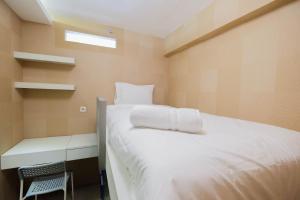 Cozy and Elegant 2BR Bassura City Apartment By Travelio