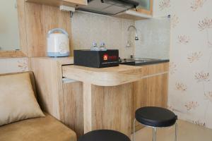 Best Furnished 2BR Mall Access at Green Pramuka Apartment By Travelio