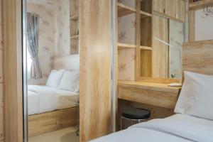 Best Furnished 2BR Mall Access at Green Pramuka Apartment By Travelio