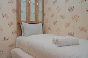 Best Furnished 2BR Mall Access at Green Pramuka Apartment By Travelio