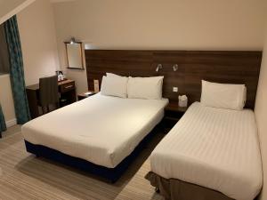Standard Family Room with One Double and One Single Bed room in Best Western Carlton Hotel