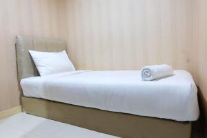 Comfy 2BR Apartment at Green Pramuka City By Travelio