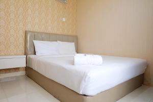 Comfy 2BR Apartment at Green Pramuka City By Travelio