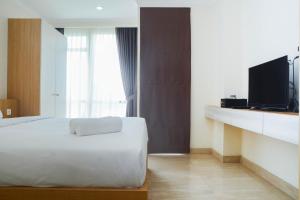 Minimalist and Comfy Studio at Menteng Park Apartment By Travelio