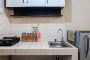 Fully Furnished Studio at Serpong Greenview Apartment By Travelio