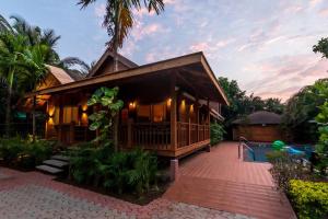 Natures Abode - The Wooden Villa at Morjim by StayVista