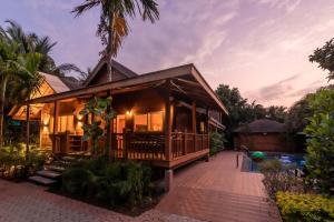 Natures Abode - The Wooden Villa at Morjim by StayVista
