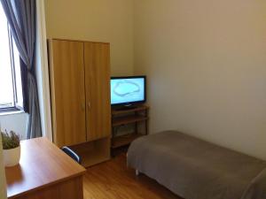 Chambre Simple avec Toilettes et Douche Communes