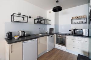Appartements Le Sphinx by Cocoonr : photos des chambres