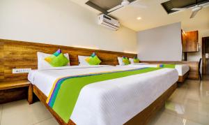 Treebo Shree Sai Suites - 2km from Mahalaxmi Temple