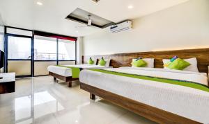 Treebo Shree Sai Suites - 2km from Mahalaxmi Temple