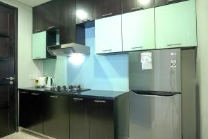 Cozy 2BR @ The Masterpiece Condominium Epicentrum Apartment By Travelio