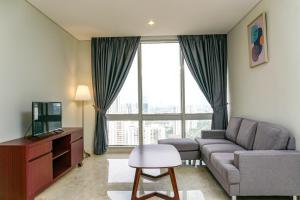 Cozy 2BR @ The Masterpiece Condominium Epicentrum Apartment By Travelio