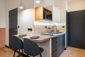 Appartements HONORE - SUITE ARBRE SEC : photos des chambres