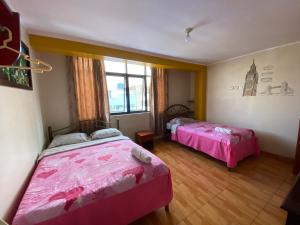 Deluxe Queen Room with Two Queen Beds room in Hostal Alcoba II