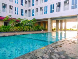 Simply Furnished Studio Grand Dhika City Apartment By Travelio