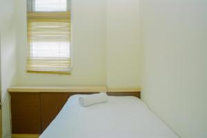 Fully Furnished and Cozy 2BR at Green Pramuka City Apartment By Travelio