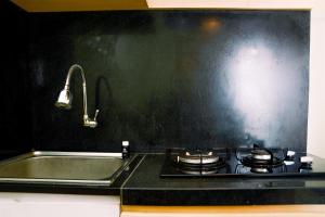 Fully Furnished and Cozy 2BR at Green Pramuka City Apartment By Travelio