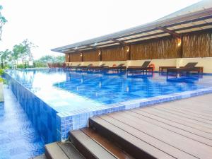 Elegant and Comfy Studio Azalea Suites Apartment Cikarang By Travelio