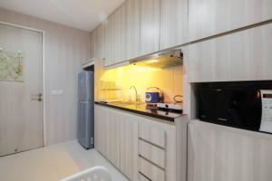 Elegant and Comfy Studio Azalea Suites Apartment Cikarang By Travelio