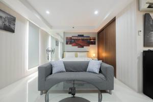 Elegant and Comfy Studio Azalea Suites Apartment Cikarang By Travelio