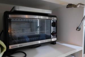 Elegant and Comfy Studio Azalea Suites Apartment Cikarang By Travelio