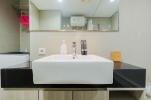 Elegant and Comfy Studio Azalea Suites Apartment Cikarang By Travelio