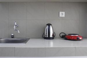 Monochrome Style Studio Room @Grand Asia Afrika Apartment By Travelio