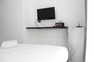 Monochrome Style Studio Room @Grand Asia Afrika Apartment By Travelio