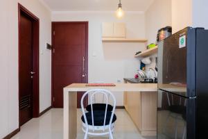 Warm and Relax 1BR at Asatti Garden House Apartment By Travelio
