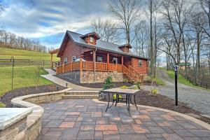 Rustic Dundee Log Cabin with Hot Tub and Forest Views!