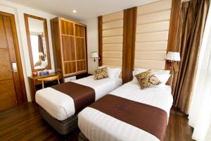 Deluxe Twin Room (2 Adults + 1 Child) room in Dreams Grand