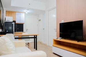 Cozy 2BR at Springlake Summarecon Bekasi Apartment By Travelio