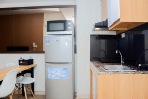 Cozy 2BR at Springlake Summarecon Bekasi Apartment By Travelio
