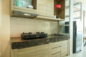 Cozy Studio Apartment at Nine Residence connected to Mall By Travelio