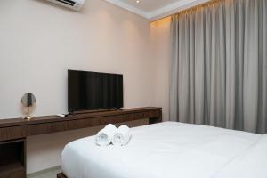 Minimalist and Cozy 2BR Citralake Suites Apartment By Travelio