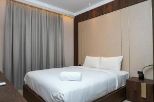 Minimalist and Cozy 2BR Citralake Suites Apartment By Travelio