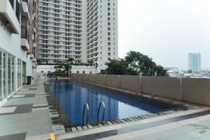 Cozy Studio Apartment at Margonda Residence 4 By Travelio