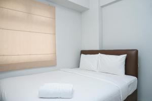Tranquil Green Pramuka 2BR Apartment near Shopping Center By Travelio