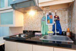 Tranquil Green Pramuka 2BR Apartment near Shopping Center By Travelio