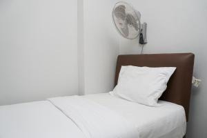 Tranquil Green Pramuka 2BR Apartment near Shopping Center By Travelio