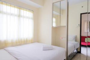 Homey 2BR at Serpong Greenview Apartment By Travelio